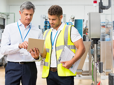 two engineers walking in manufacturing plant
